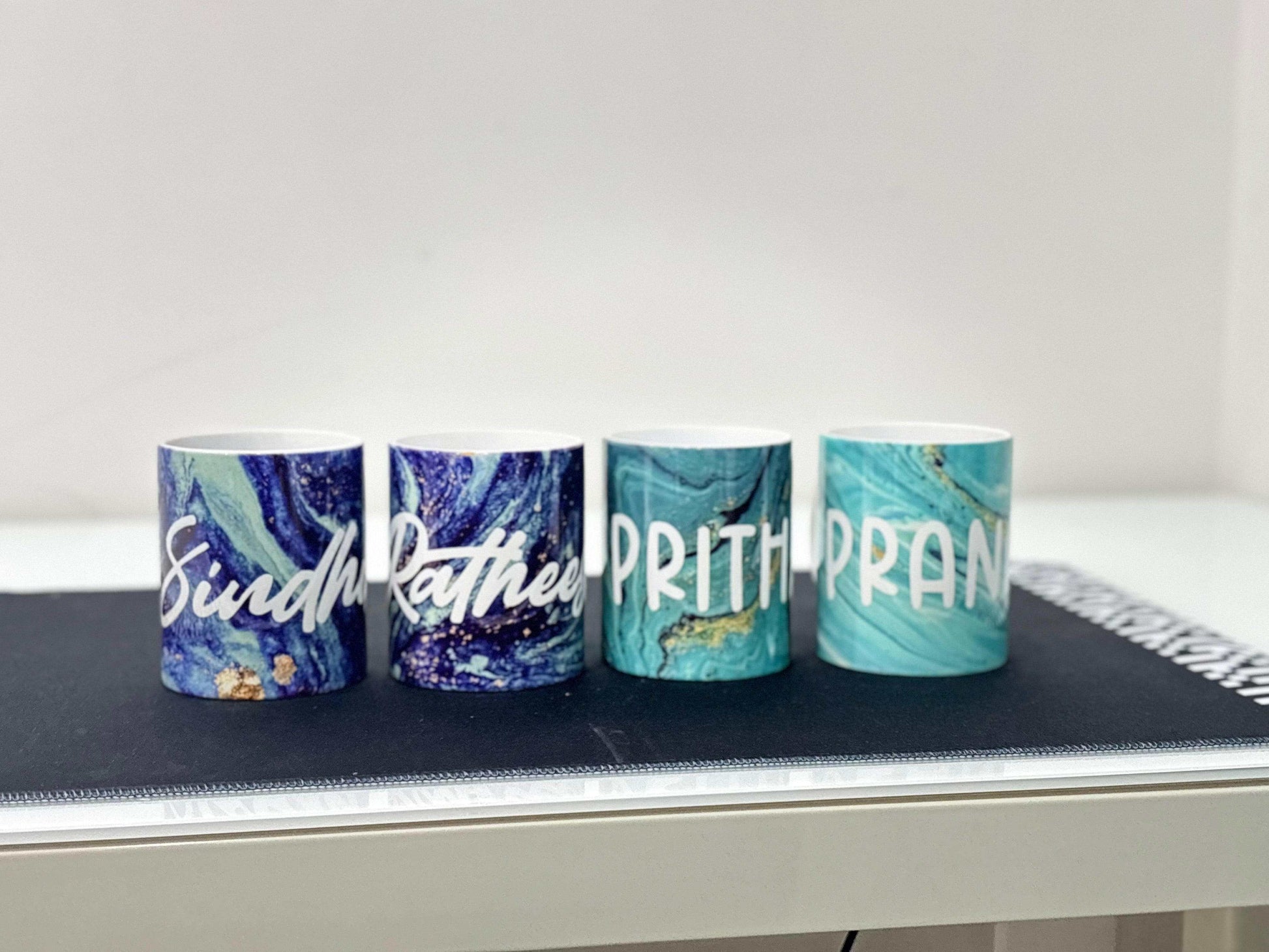 Family pack of custom text mugs by Makers Morph showcasing personalized designs for special occasions.